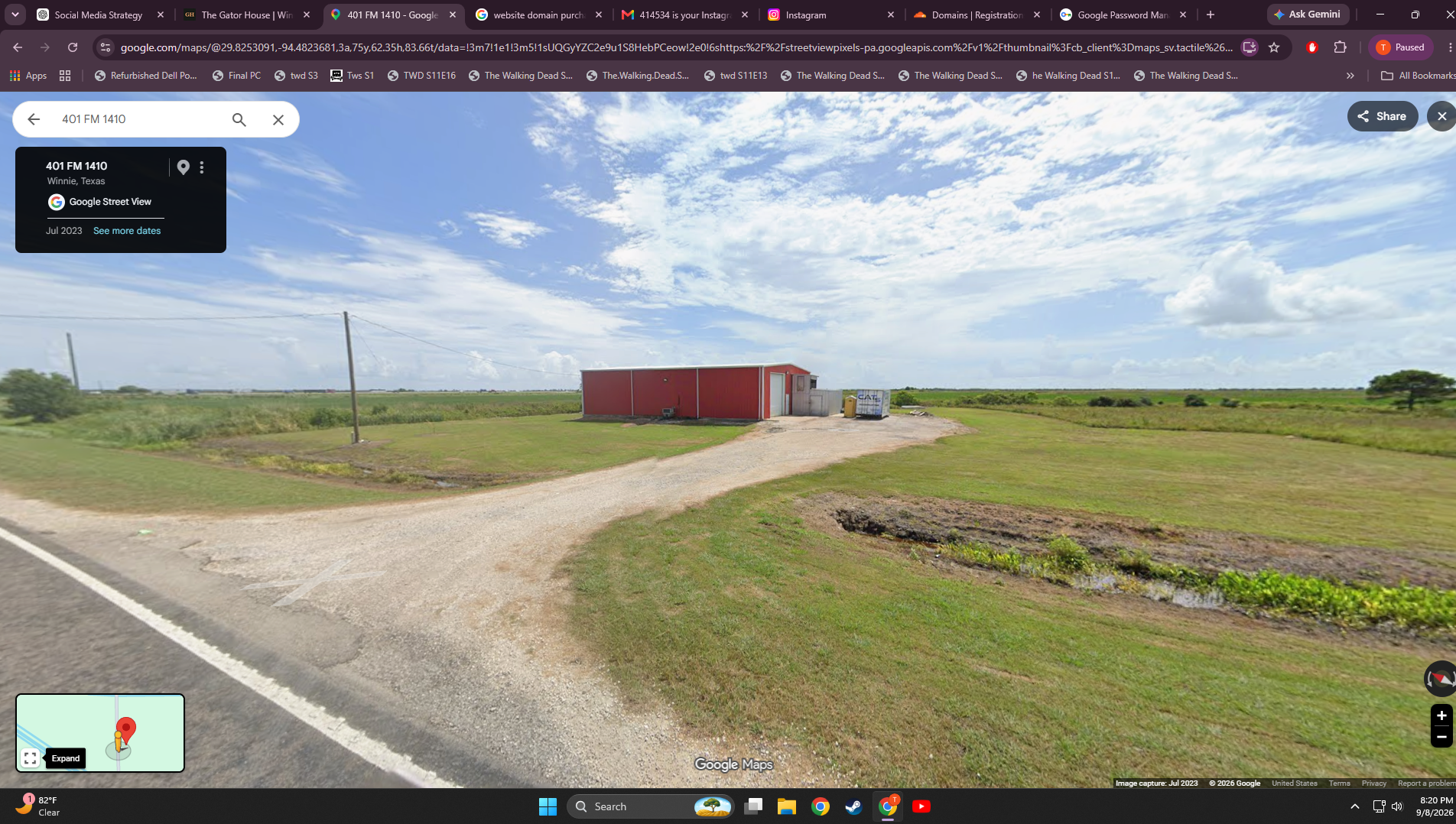 Roadside view of the red Gator House barn and gravel entrance on FM 1410